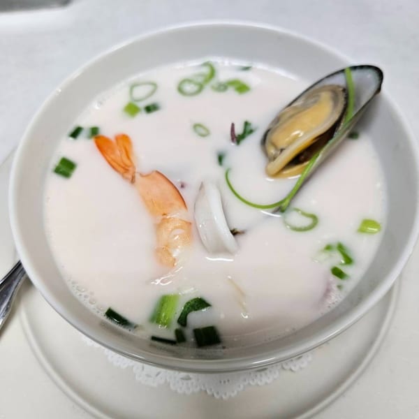 Erawan's Tom Kha Talay, a creamy coconut soup with shrimp, squid, scallops, and a mussel.