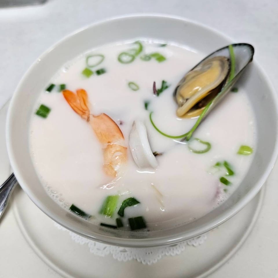 Erawan's Tom Kha Talay, a creamy coconut soup with shrimp, squid, scallops, and a mussel.