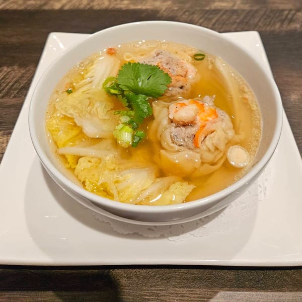 Erawan's Thai wonton soup with shrimp, pork, napa cabbage, and cilantro in a clear broth.