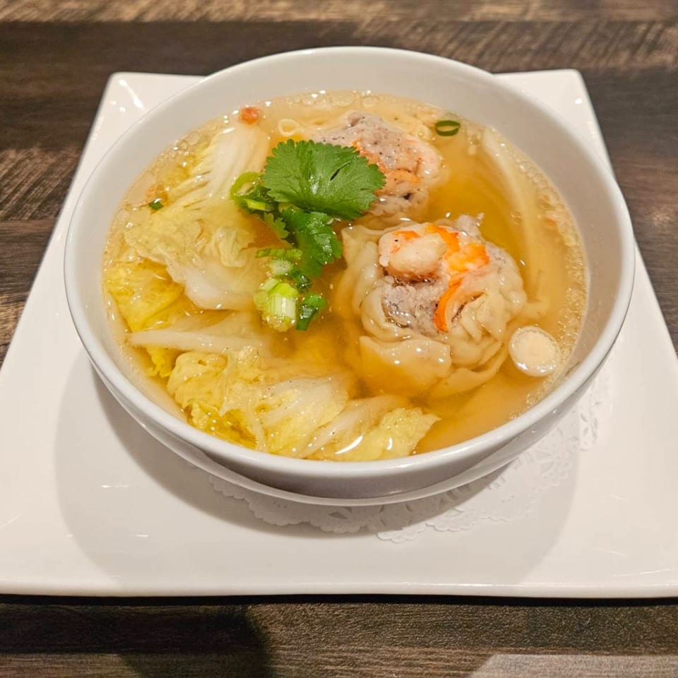 Erawan's Thai wonton soup with shrimp, pork, napa cabbage, and cilantro in a clear broth.